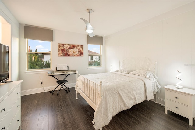 bedroom with dark hardwood / wood-style flooring