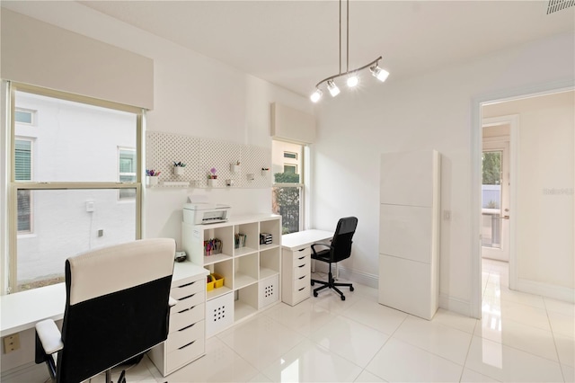 tiled home office featuring plenty of natural light