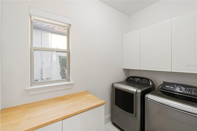 laundry area with cabinets and independent washer and dryer