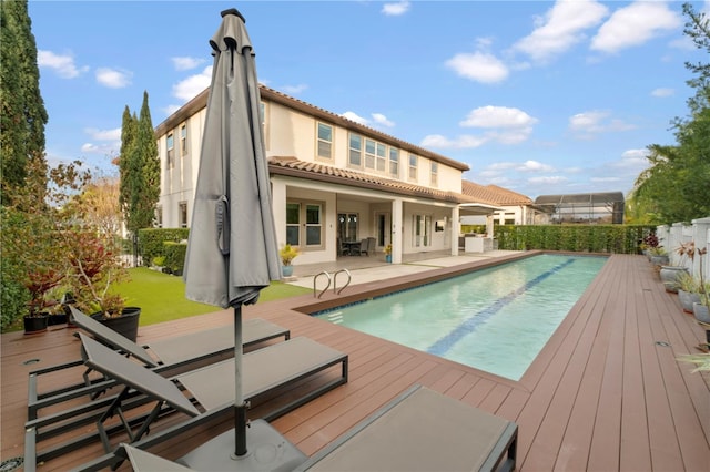 view of pool with a wooden deck