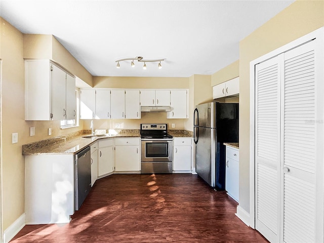 kitchen with white cabinets, dark hardwood / wood-style floors, sink, and stainless steel appliances