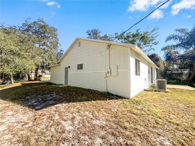 view of side of property with central AC unit