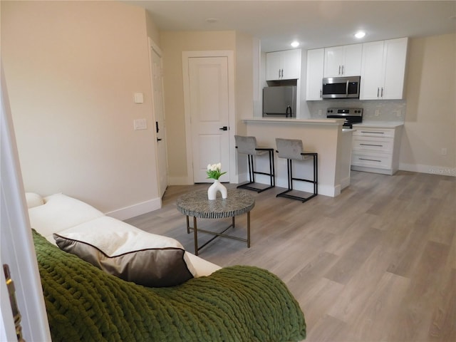 living room with light hardwood / wood-style floors