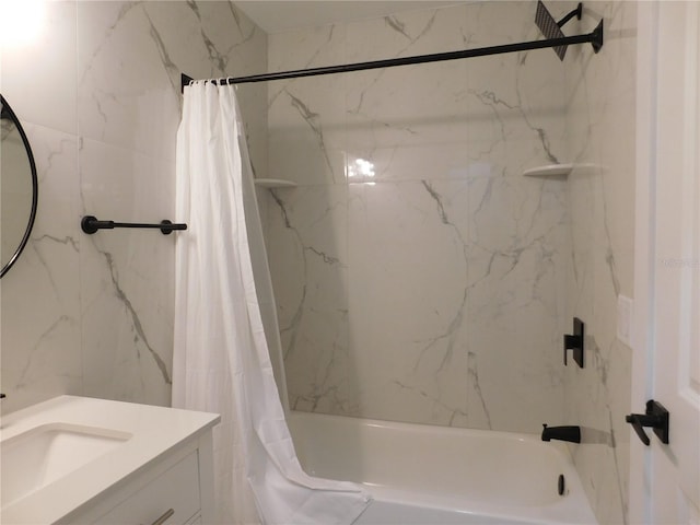 bathroom featuring vanity and shower / bathtub combination with curtain