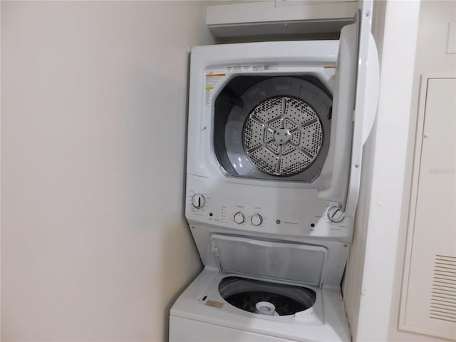 washroom with stacked washer / dryer