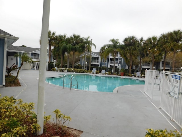 view of swimming pool with a patio