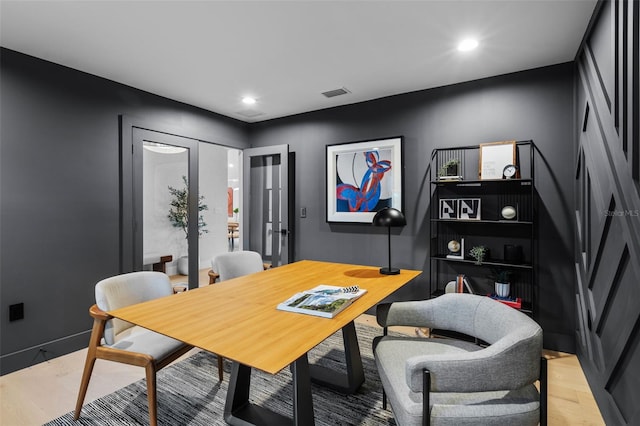 office with french doors and light wood-type flooring