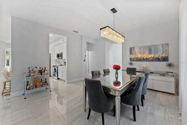 dining space featuring a chandelier