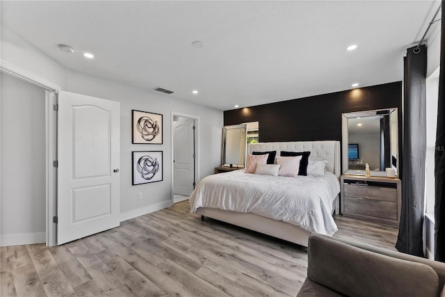 bedroom featuring light wood-type flooring