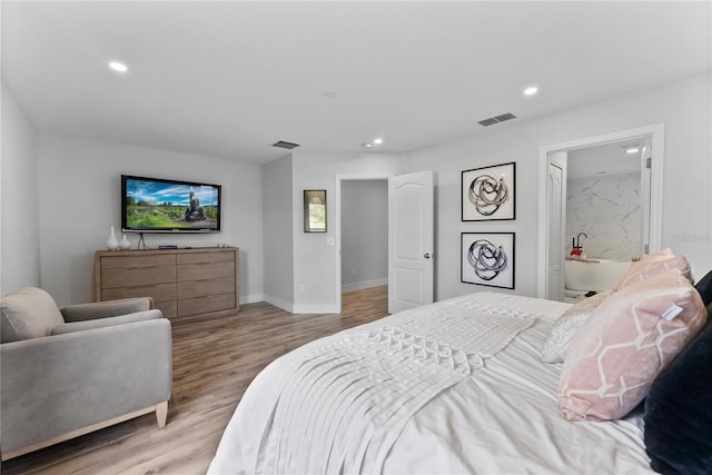 bedroom with light hardwood / wood-style floors