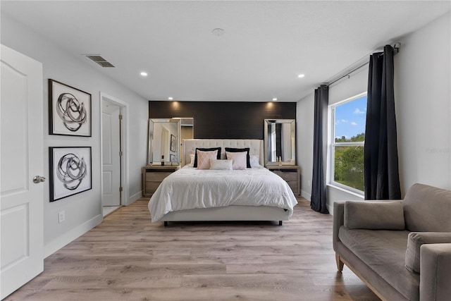 bedroom with light wood-type flooring