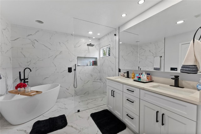 bathroom featuring vanity and separate shower and tub