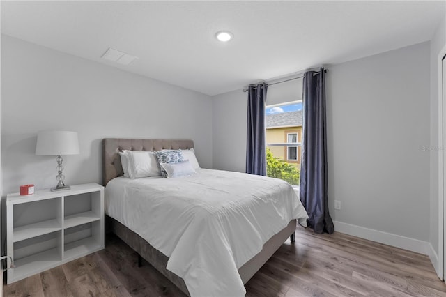 bedroom with wood-type flooring