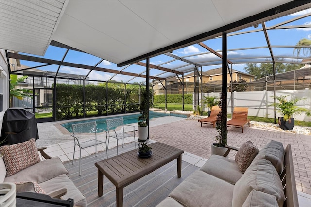 view of patio / terrace with a lanai, an outdoor hangout area, a fenced in pool, and grilling area