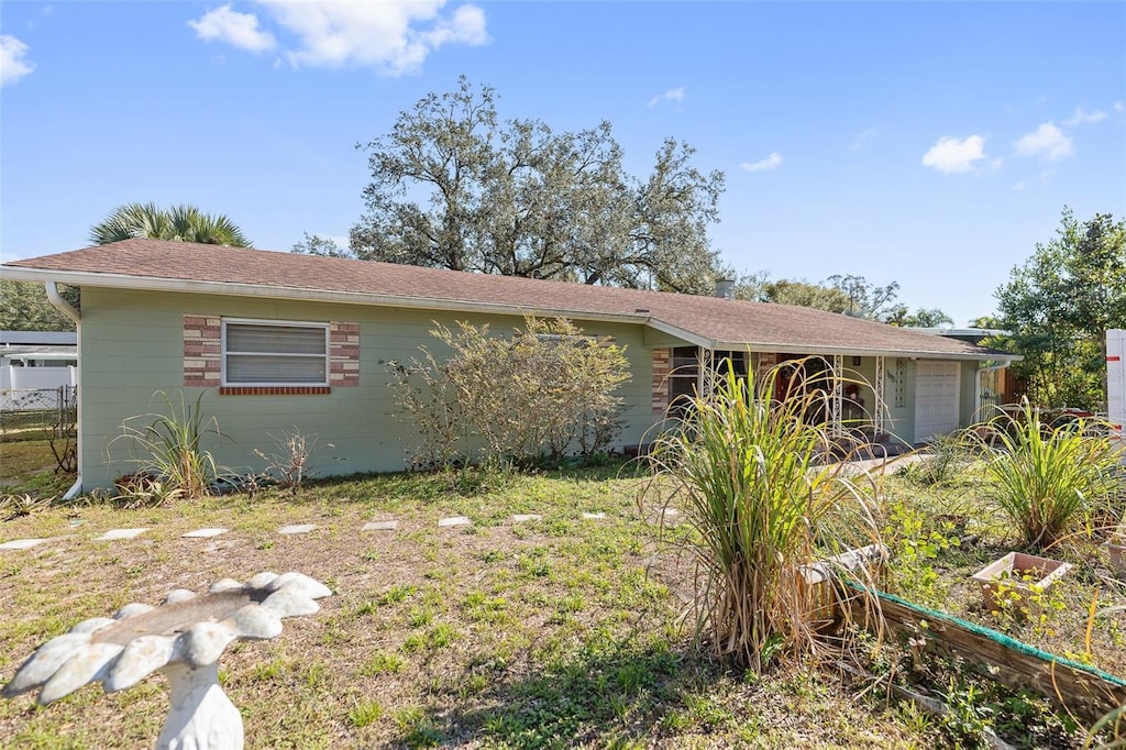 ranch-style home featuring a garage