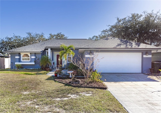 ranch-style house featuring a front yard and a garage