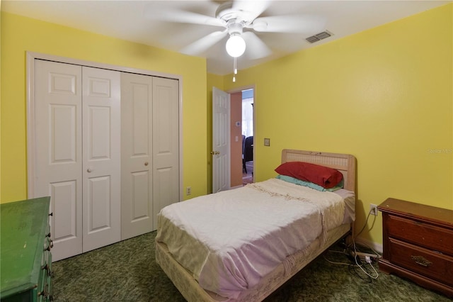 carpeted bedroom featuring a closet and ceiling fan