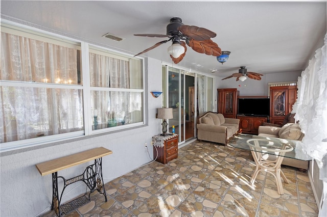 living room featuring ceiling fan