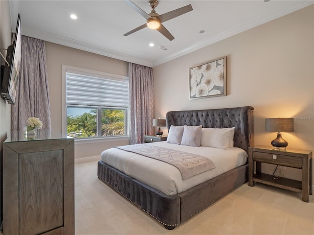 bedroom with light carpet, ceiling fan, and ornamental molding