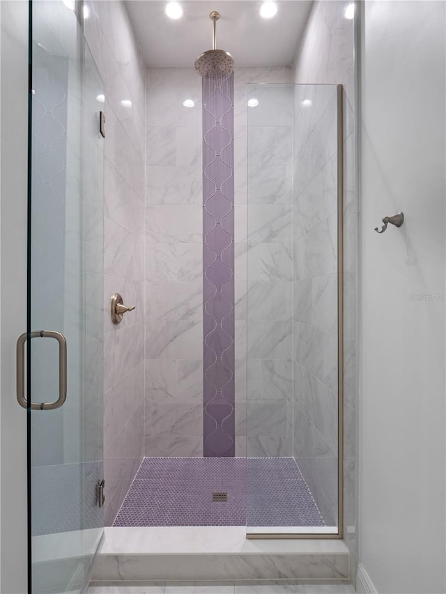 bathroom with an enclosed shower