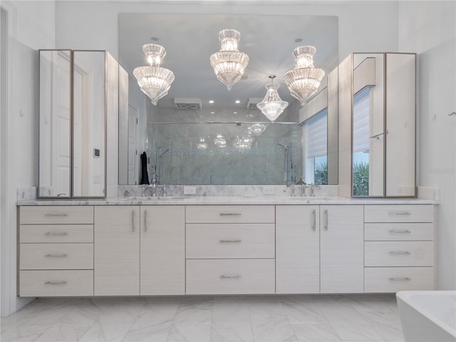 bathroom with vanity and a chandelier