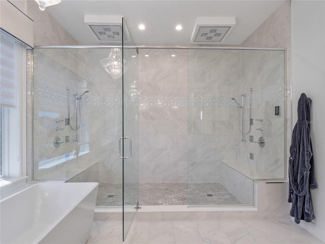 bathroom with separate shower and tub