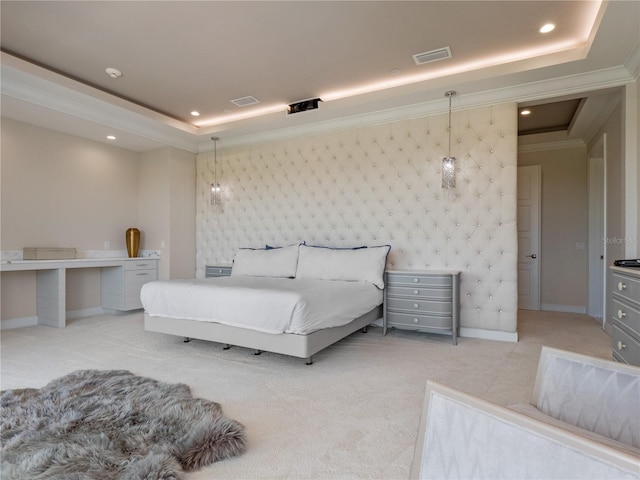 bedroom featuring ornamental molding, a tray ceiling, and light colored carpet