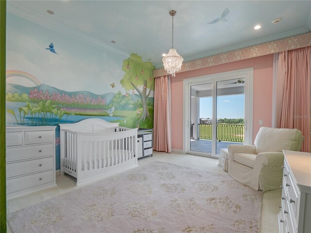 bedroom with light carpet, crown molding, access to outside, and a nursery area