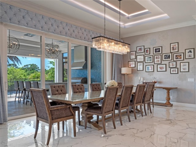 dining area with a raised ceiling and crown molding