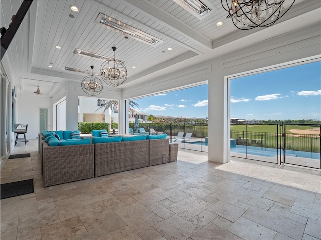 interior space featuring a raised ceiling, a water view, and wood ceiling