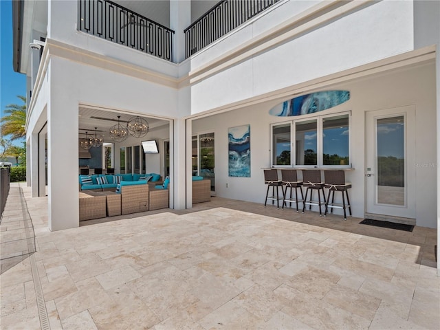 view of patio / terrace with an outdoor living space and an outdoor bar