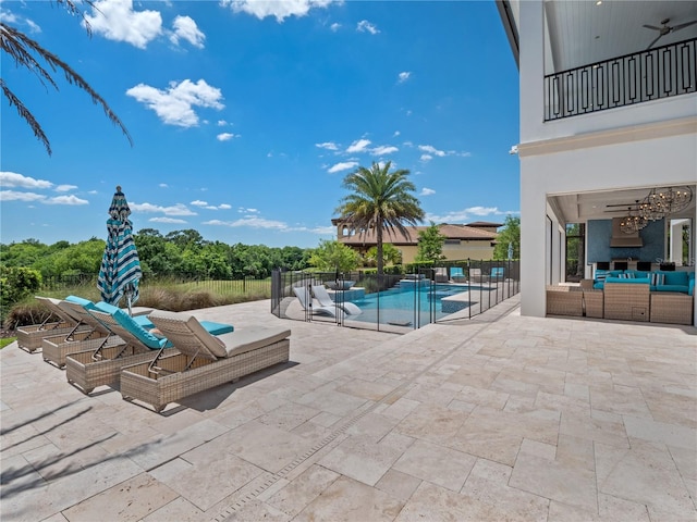 view of swimming pool featuring an outdoor living space and a patio area