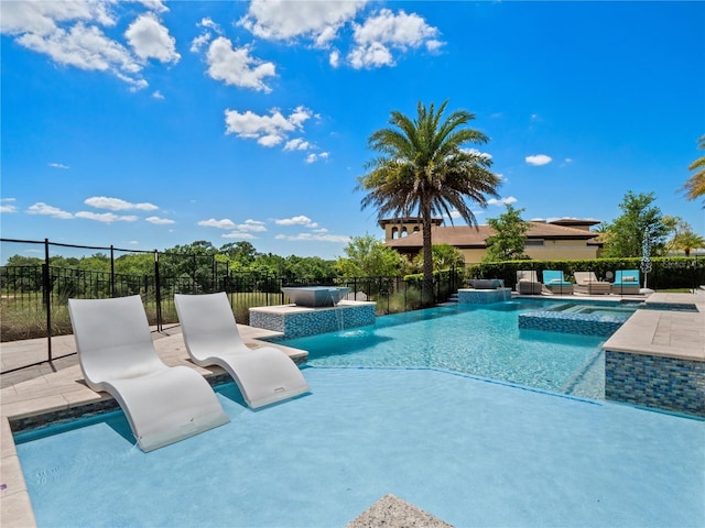 view of swimming pool with pool water feature, an outdoor living space, and a patio area