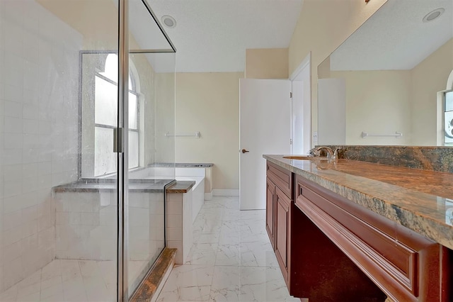 bathroom with separate shower and tub and vanity