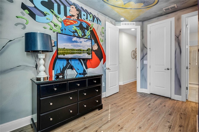 bedroom featuring light wood-type flooring