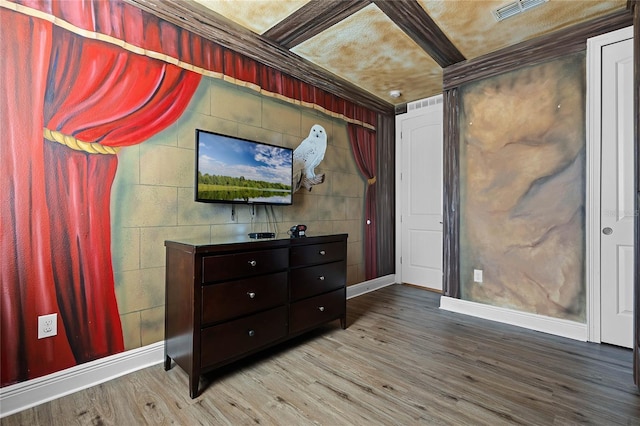 bedroom featuring hardwood / wood-style floors and ornamental molding