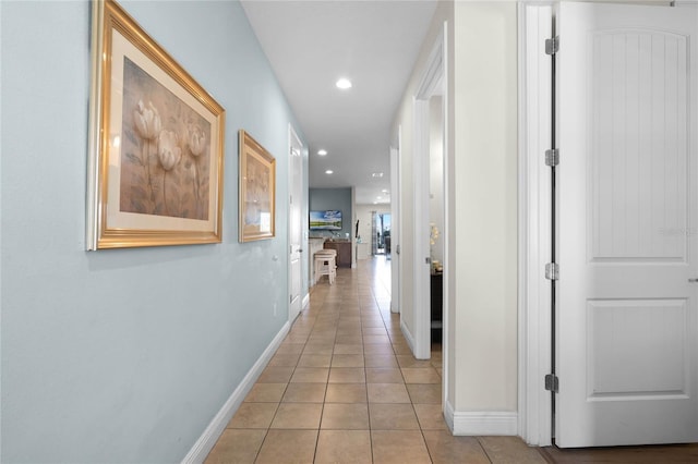 corridor with light tile patterned flooring