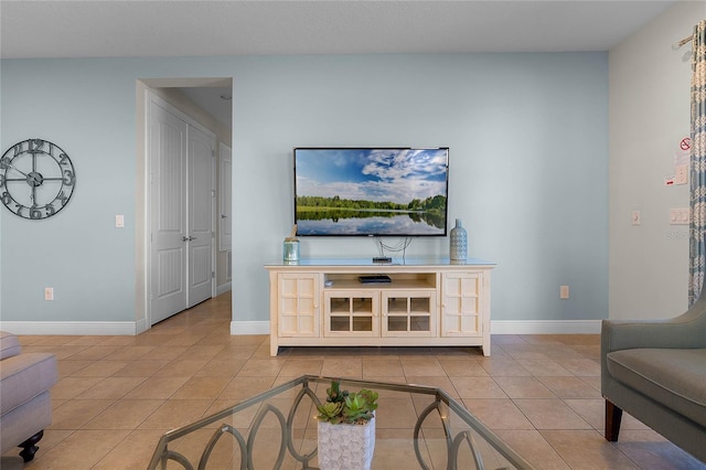 living room with light tile patterned flooring