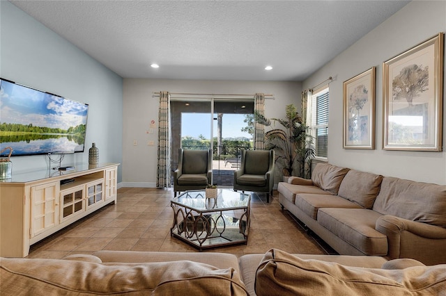 living room with light tile patterned floors and a textured ceiling