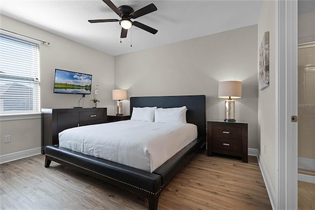 bedroom with light wood-type flooring and ceiling fan