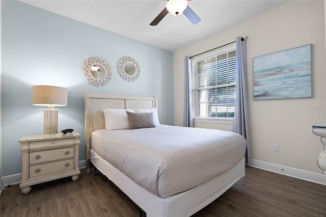 bedroom with ceiling fan and dark hardwood / wood-style flooring