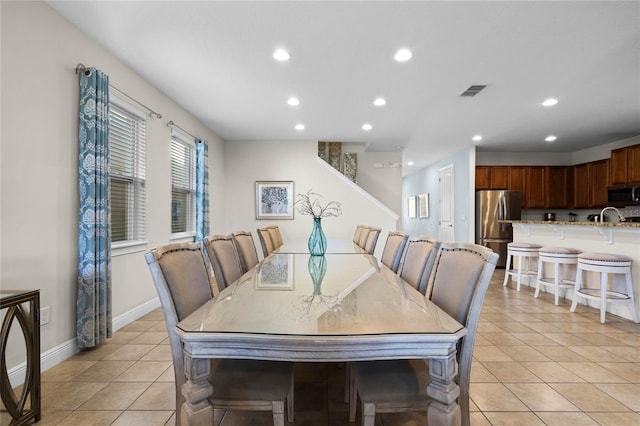 dining area featuring light tile patterned floors