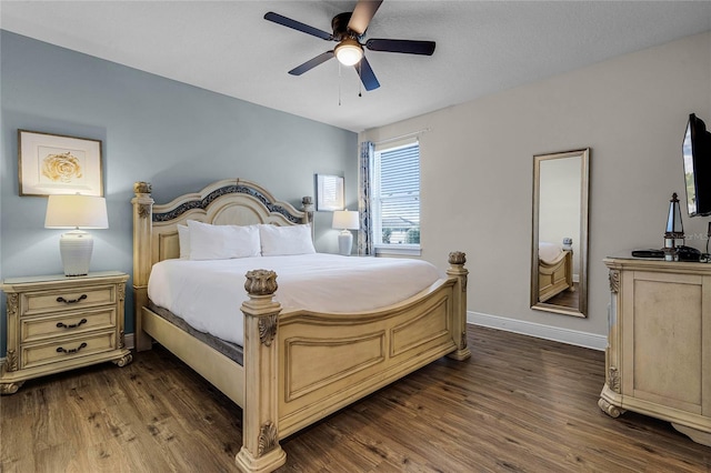 bedroom with ceiling fan and dark hardwood / wood-style flooring