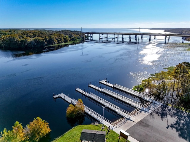 dock area with a water view and central air condition unit