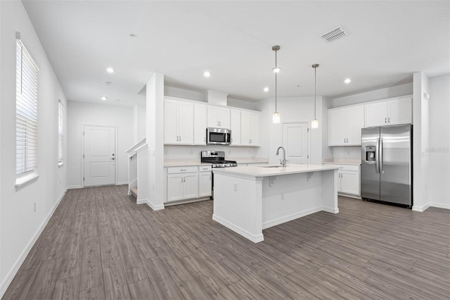 kitchen featuring white cabinetry, appliances with stainless steel finishes, and sink