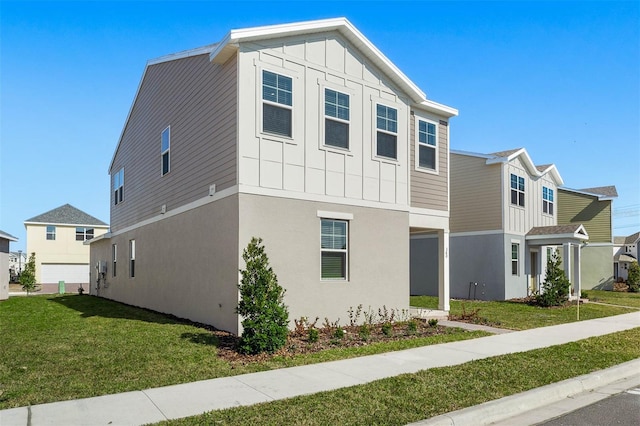 view of front of home featuring a garage and a front lawn