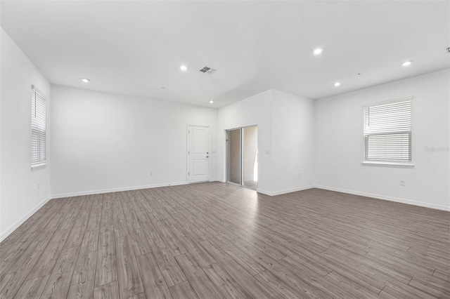 spare room featuring light hardwood / wood-style flooring