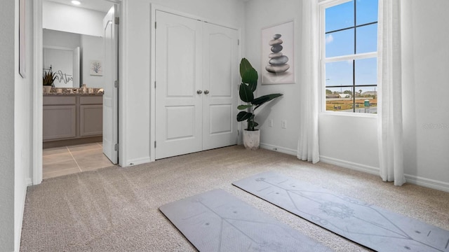 view of carpeted foyer entrance