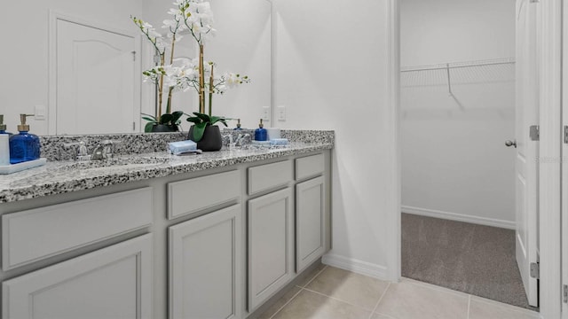 bathroom featuring tile patterned flooring and vanity