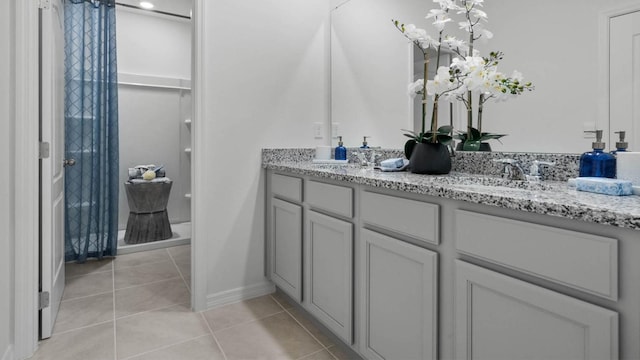 bathroom with tile patterned flooring and vanity